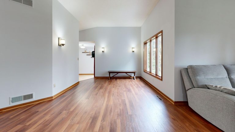 Warm oak hardwood flooring in an empty Colorado room