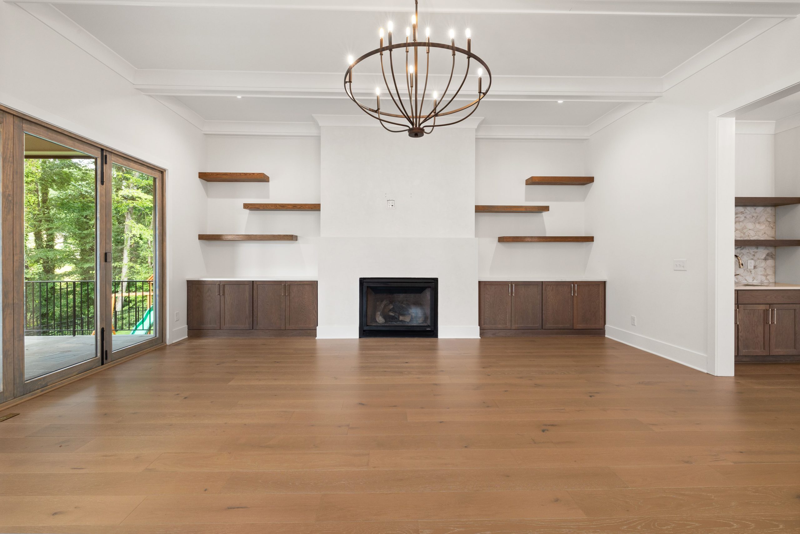 Wide plank oak hardwood flooring in a bright Colorado living room