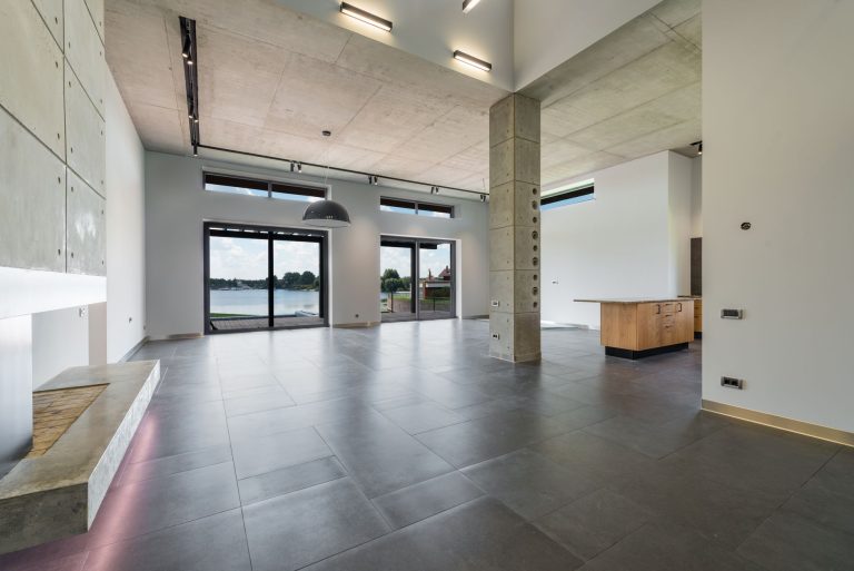 Large-format natural stone flooring in a bright Colorado interior